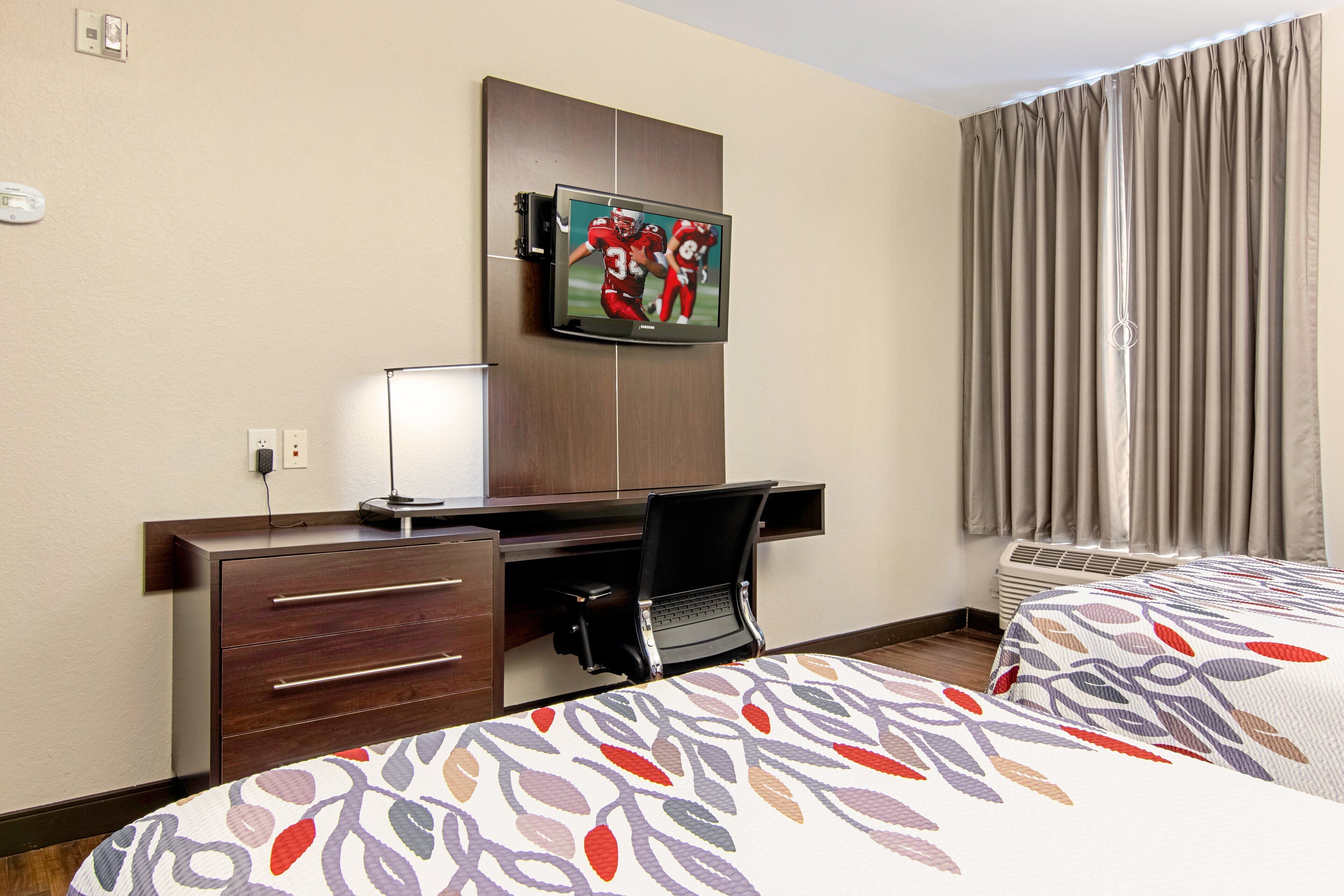 premium bedding, pillow-top beds, desk, blackout curtains