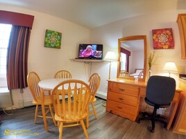 Room Two queen beds with kitchenette | Living area | TV