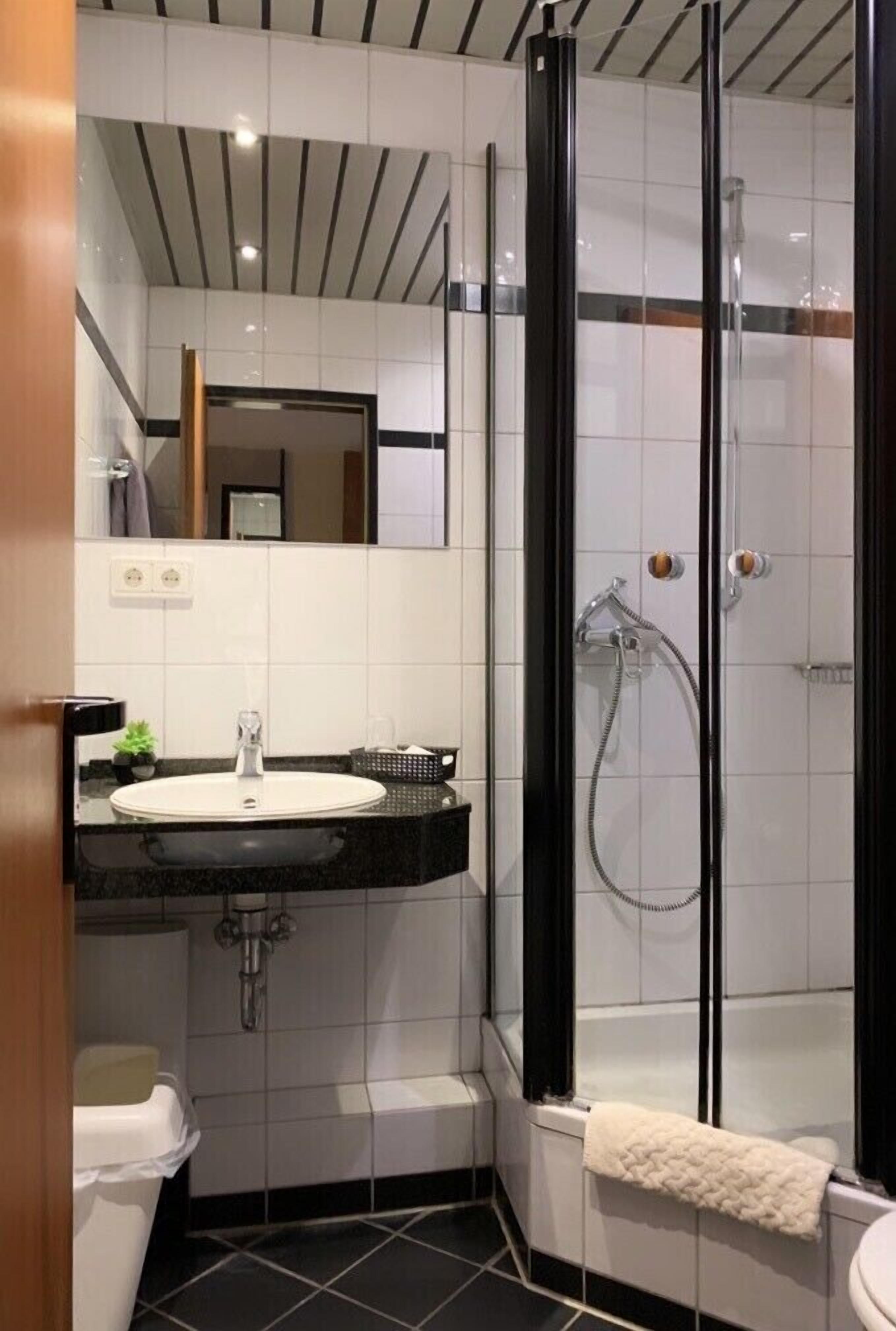 single room | bathroom | shower, hair dryer, towels