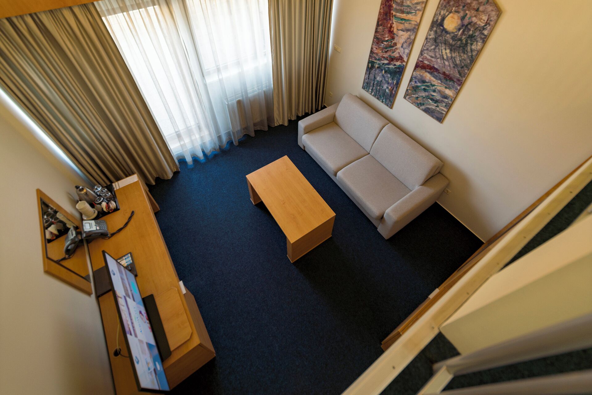 mezzanine room | 1 bedroom, minibar, in-room safe, desk