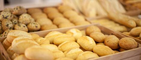 A variety of baked goods in wooden trays.