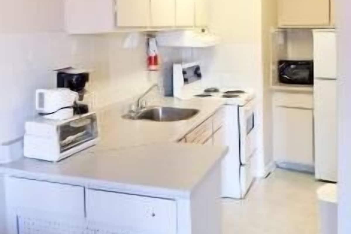 fridge, microwave, coffee/tea maker, cookware/dishes/utensils