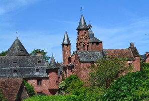 A historic building with multiple towers and a prominent bell tower.