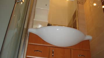 Shower, towels, soap, toilet paper