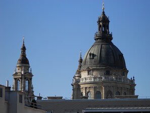 A large, historic building with a prominent dome and a smaller tower. - Trendy Deluxe Apartments (Budapest)