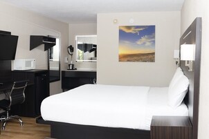 標準客房, 1 張特大雙人床 | 遮光布/窗簾、隔音、免費無線上網、床單