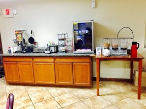 Fully equipped kitchen with stove, microwave, and ample counter space.