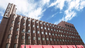 A high-rise hotel with a modern architectural design, featuring a prominent 'HOTEL' sign on the facade. - Shibuya Tobu Hotel (Tokyo)