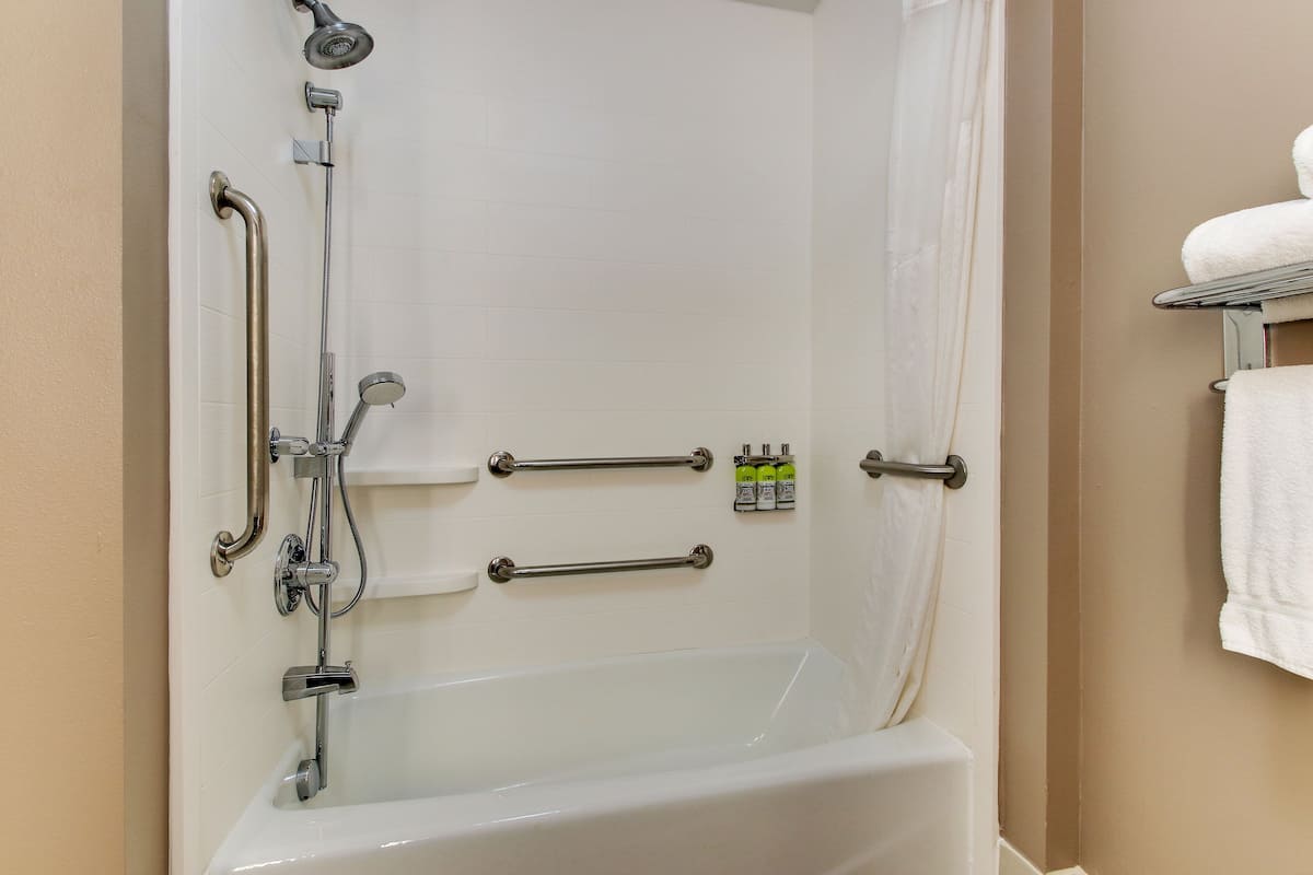 bathtub, hair dryer, towels