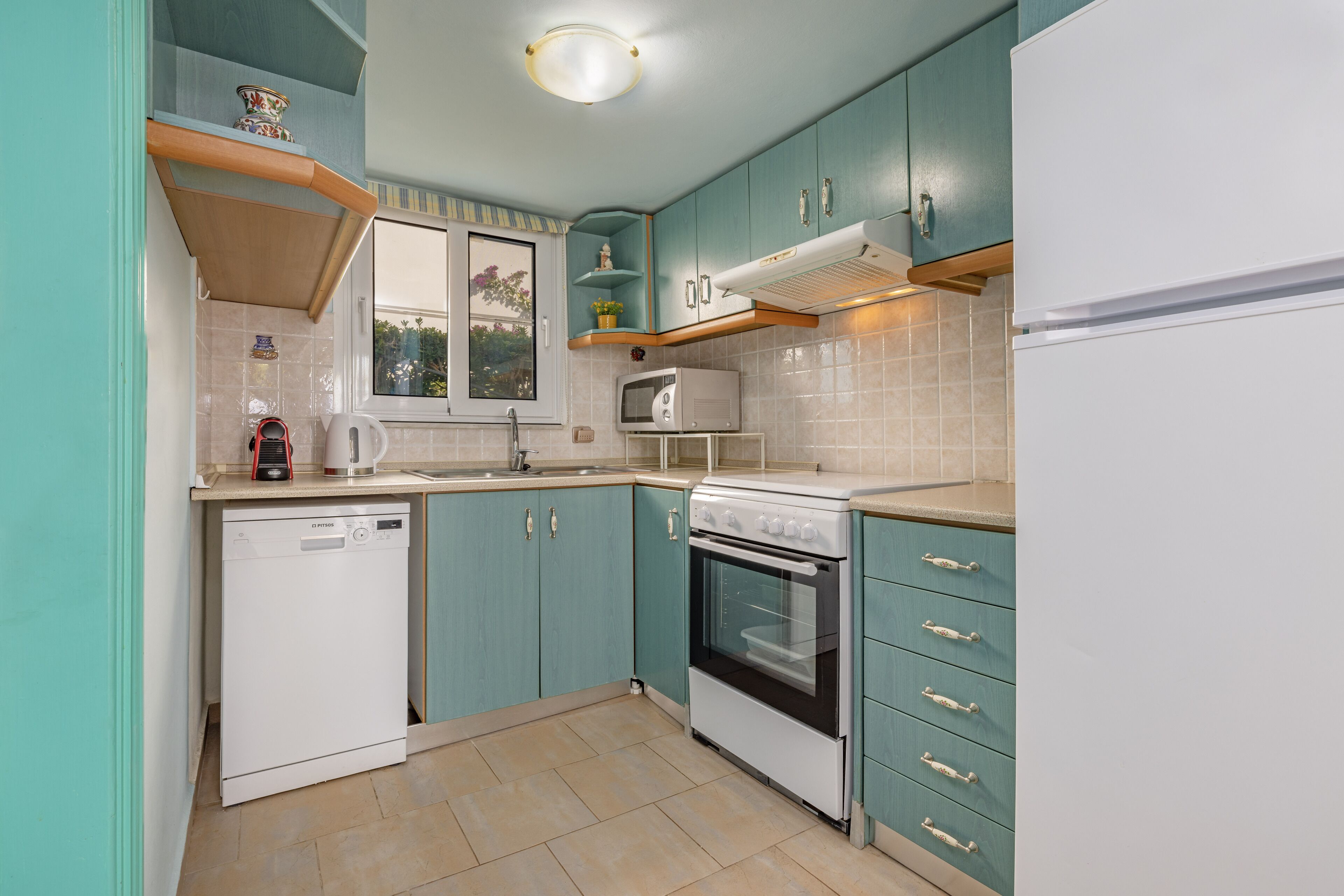 superior apartment, sea view, ground floor | private kitchen | full-sized fridge, coffee/tea maker, cookware/dishes/utensils