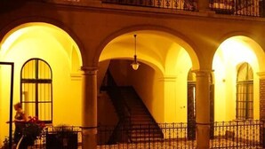A multi-level building with arched balconies and a staircase. - RingAvenue Apartments (Budapest)