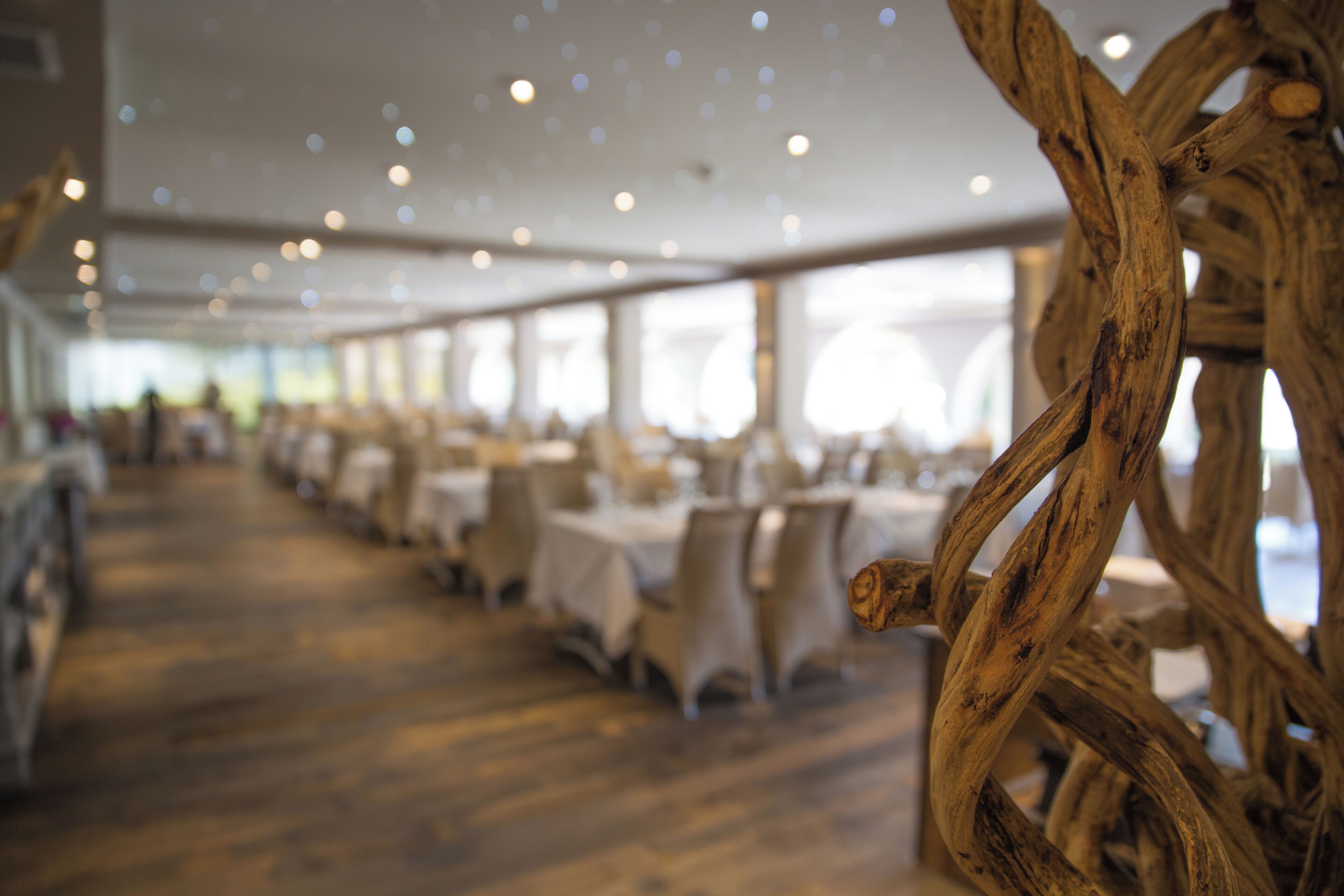 A spacious indoor venue with tables and chairs arranged for dining.