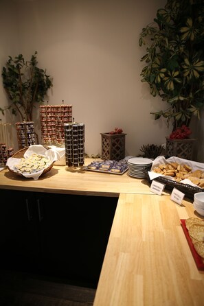 A buffet table with various food items and labeled containers. - Campo Dell'Oro (Ajaccio)