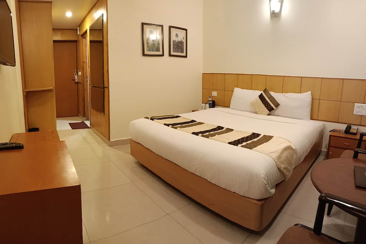 Premium bedding, laptop workspace, iron/ironing board, rollaway beds