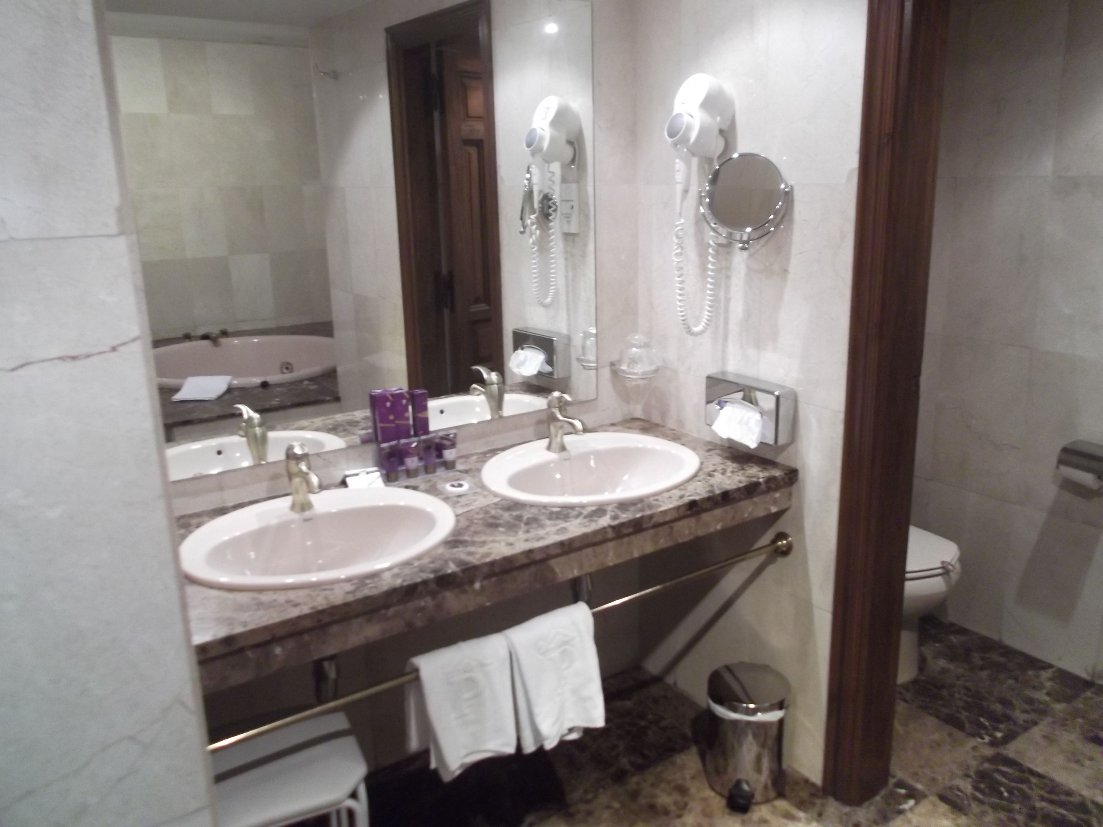 bathtub, free toiletries, hair dryer, towels