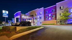 A hotel with a modern design, featuring a prominent sign for Best Western Oasis Inn. - Best Western Oasis Inn (Canadian)