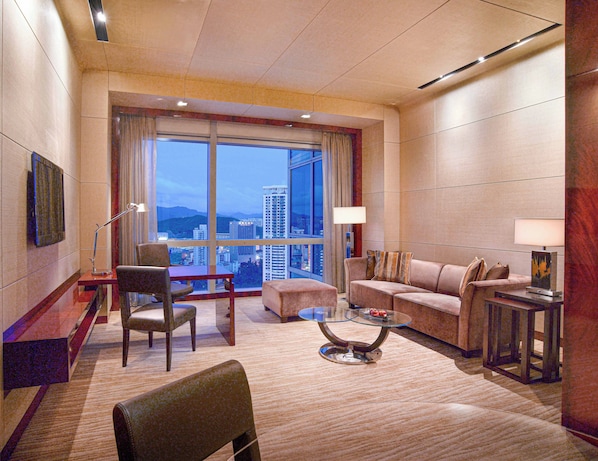 A modern hotel room with a large window, a sofa, a coffee table, and a desk. - Grand Hyatt Shenzhen (Shenzhen)