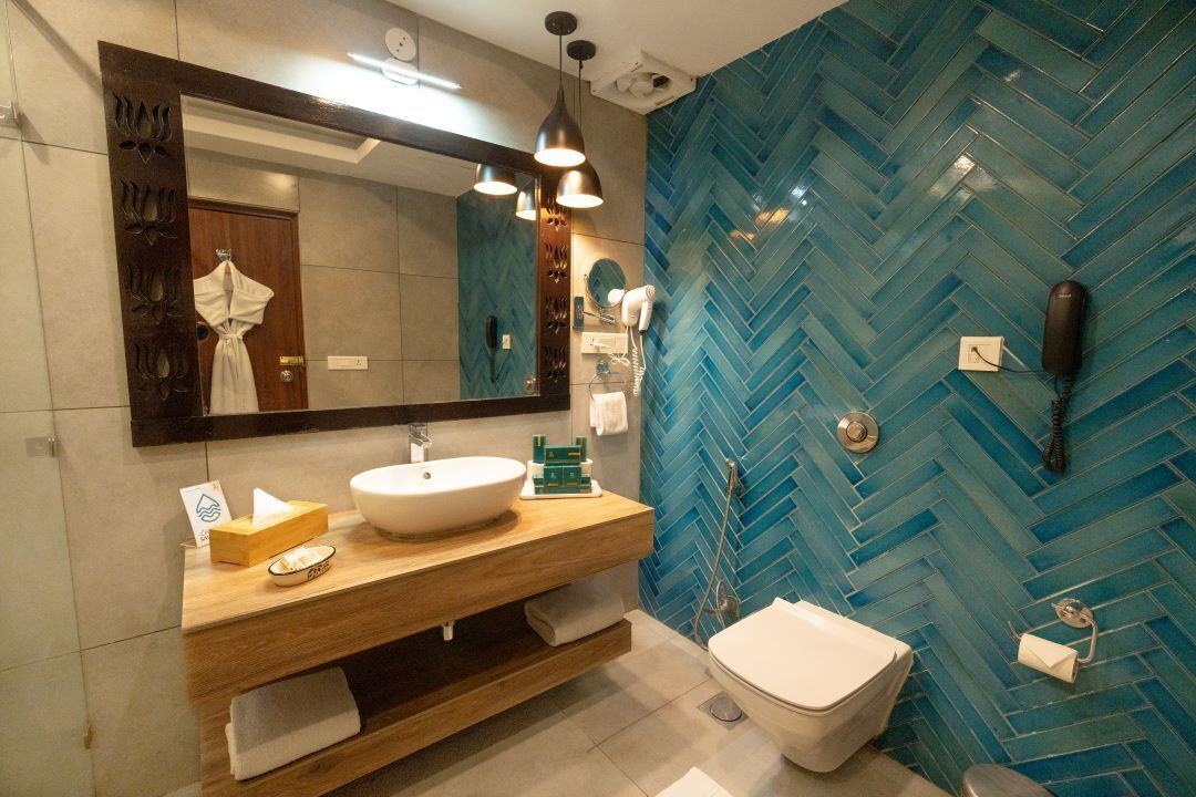 premium room river view with balcony | bathroom | rainfall showerhead, free toiletries, hair dryer, towels