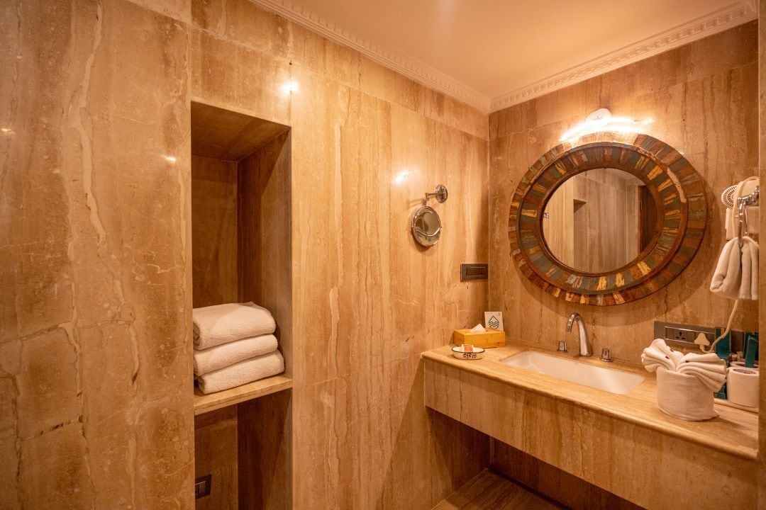 lotus suite with balcony | bathroom | rainfall showerhead, free toiletries, hair dryer, towels