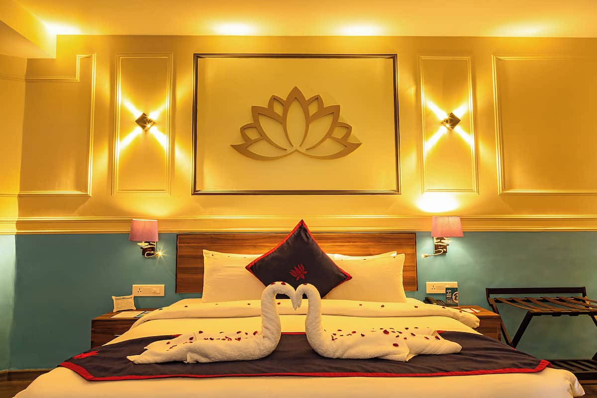 family room- partial river view | in-room safe, individually decorated, individually furnished, desk