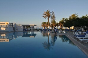 Indoor pool, seasonal outdoor pool, pool umbrellas, pool loungers