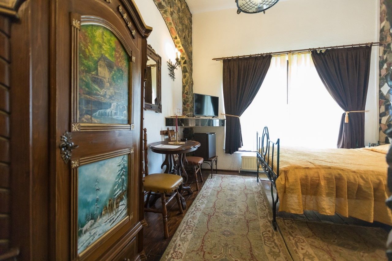 economy double room | 1 bedroom, minibar, in-room safe, blackout curtains