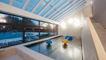 Relax by the pool surrounded by play structures and enjoy a clear view of the outdoors.