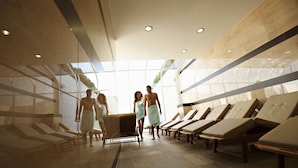 A modern spa with wooden loungers, a glass wall, and a ceiling with recessed lighting. - Hotel Livada Prestige - Sava Hotels & Resorts (Moravske Toplice)