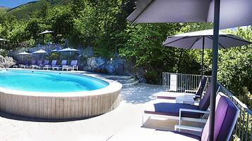 Outdoor pool, open 9:30 AM to 7:30 PM, pool umbrellas, pool loungers