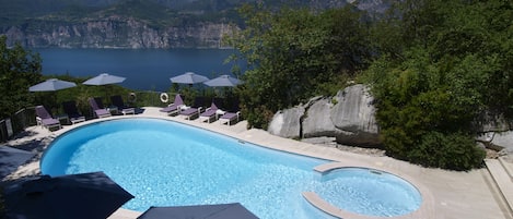 Outdoor pool, open 9:30 AM to 7:30 PM, pool umbrellas, pool loungers