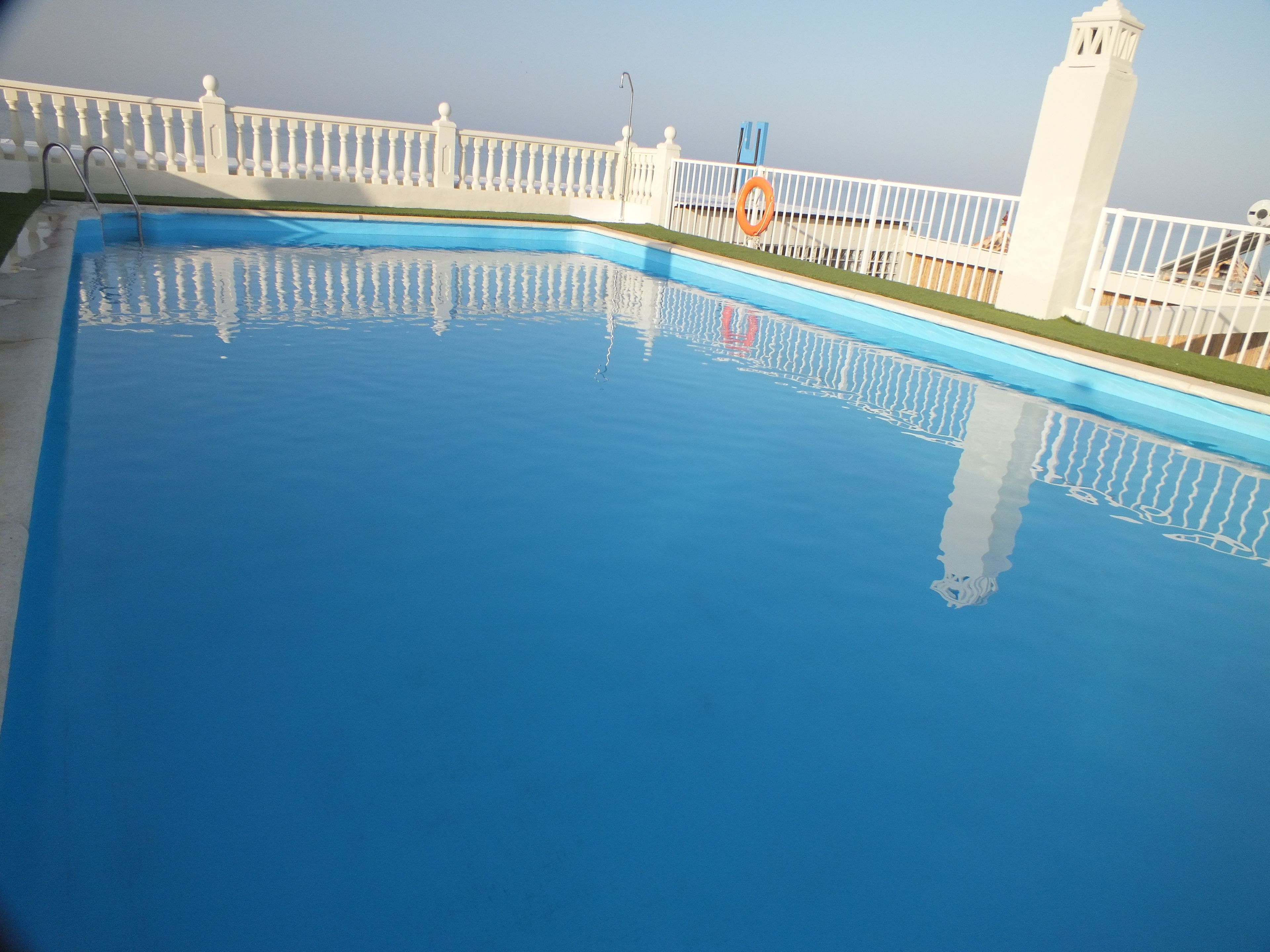 seasonal outdoor pool, pool umbrellas, pool loungers