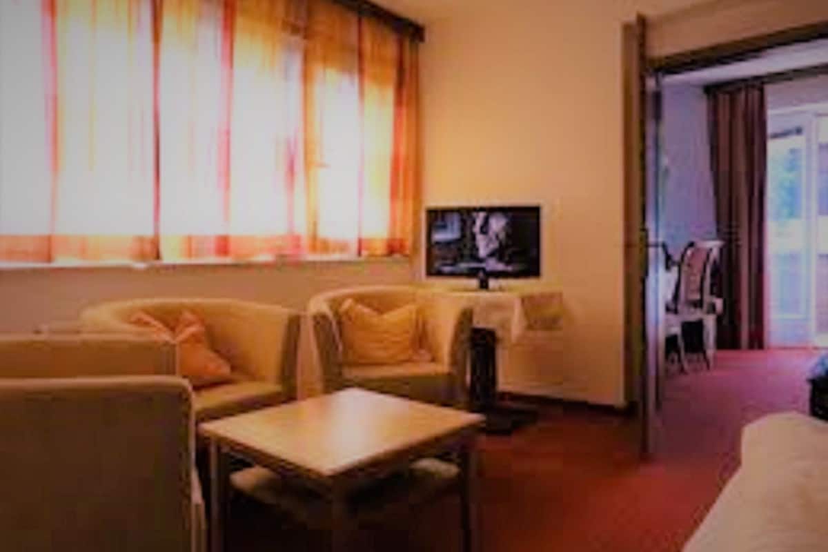 family quadruple room, 2 bedrooms, balcony | living area | lcd tv