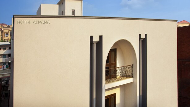 A building with a sign reading "HOTEL ALPANA". - Alpana Hotel (Haridwar)