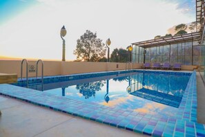 Outdoor pool, open 8:30 AM to 7 PM, pool umbrellas, sun loungers - ASIA SPA RESORT MCLEODGANJ, DHARAMSHALA CENTRALLY AIR CONDITIONED WITH HEATED SWIMMING POOL (Dharamshala)