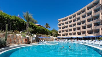 Outdoor pool, pool umbrellas, lifeguards on site