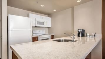 Suite, 1 Bedroom | Private kitchen | Full-size fridge, microwave, stovetop, coffee/tea maker