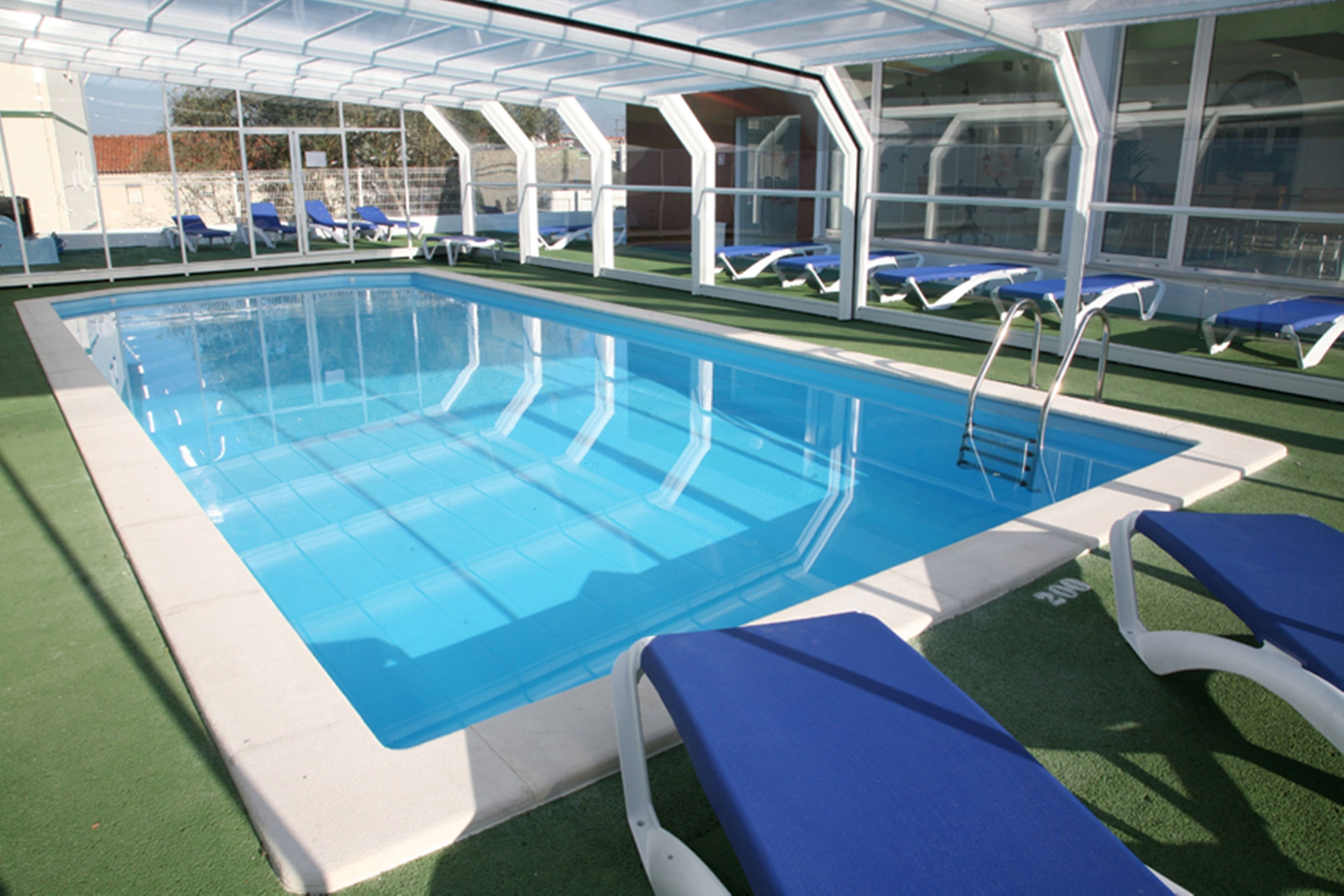 indoor pool, outdoor pool, open 9 am to 9 pm, pool loungers