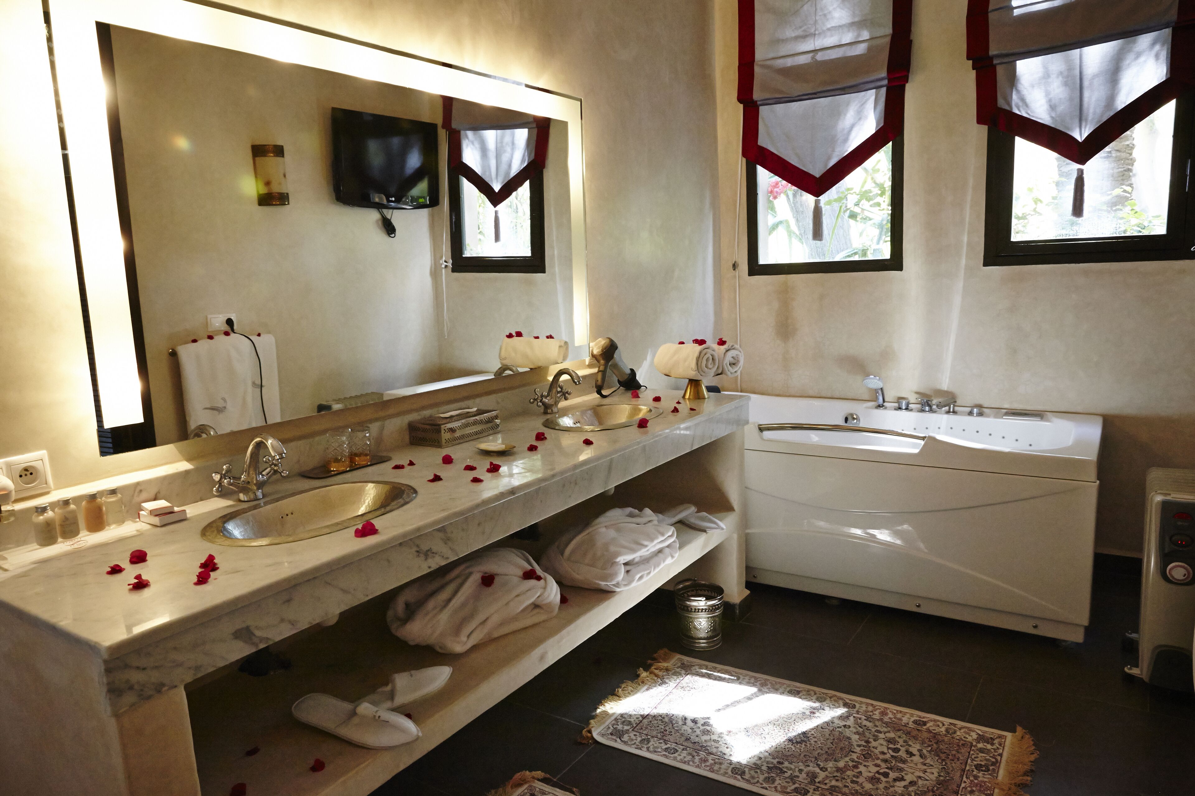 luxury suite | bathroom | free toiletries, hair dryer, slippers, towels