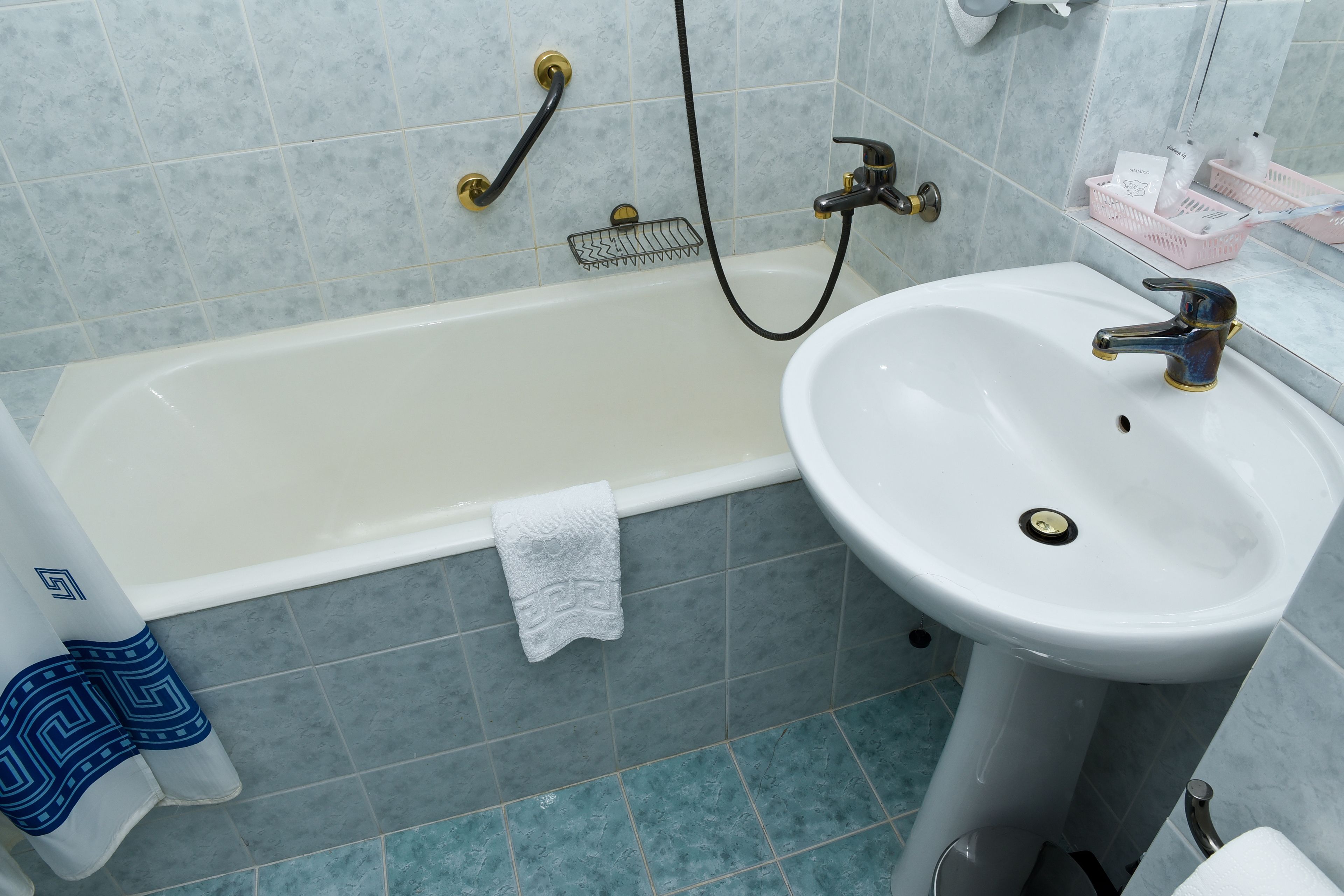 combined shower/bathtub, hair dryer, bathrobes, slippers