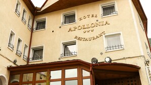 A hotel named "Hotel Apollonia" with a traditional architectural style, featuring a corner entrance and multiple windows with balconies. - Hotel Apollonia (Brasov)