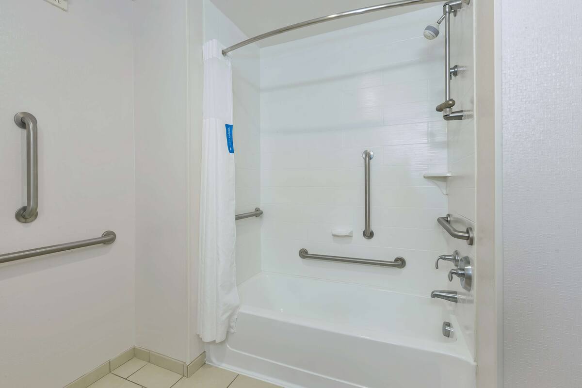 bathtub, hair dryer, towels