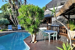 Outdoor pool, pool umbrellas, pool loungers