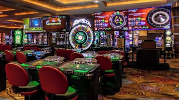 Experience the excitement of the casino floor, where slot machines and roulette wheels await your next bet.