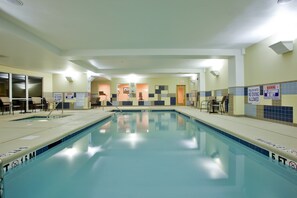 A swimming pool with a 15-meter length and 5-foot width, surrounded by tiled walls and a ceiling with recessed lighting.