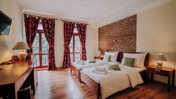 Habitación Confort con 1 cama matrimonial o 2 individuales | Ropa de cama de alta calidad y minibar