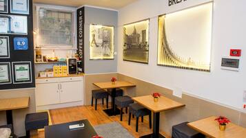 Standard Quadruple Room | Living area | 24-inch LCD TV with digital channels, TV, Netflix