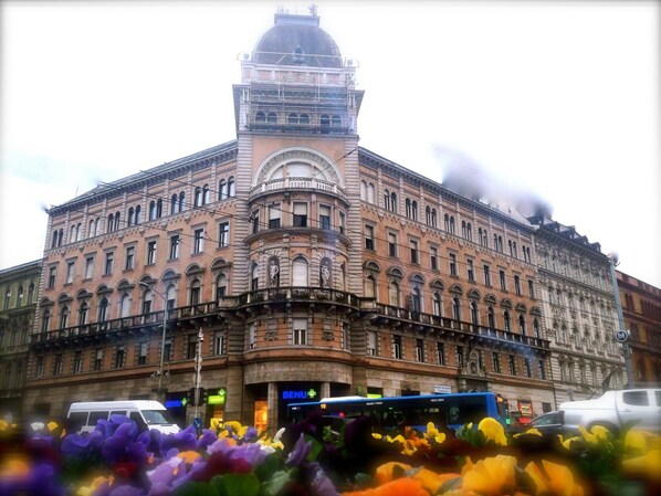 A large, historic building with a prominent tower and multiple windows. - Europa Centerpoint Guesthouse (Budapest)