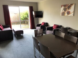 3 Bedroom Apartment with 2 Bathroom, Spa Bath and Full Kitchen | Living area | Flat-screen TV, DVD player