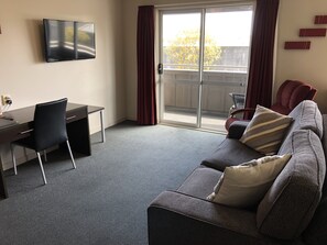 1 Bedroom Luxury Apartment with Spa Bath and Kitchenette | Living area | Flat-screen TV, DVD player