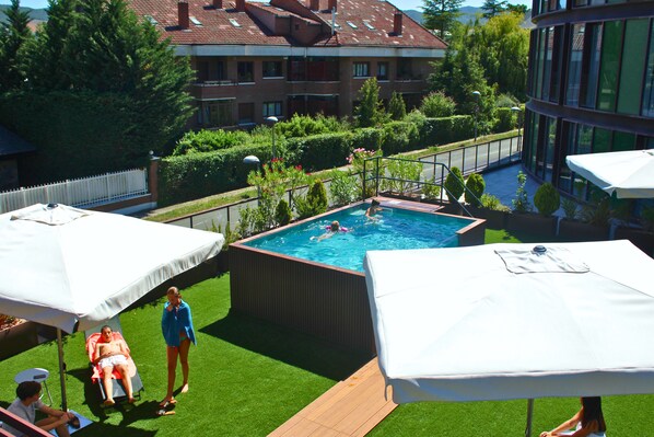 Outdoor pool, pool umbrellas, pool loungers
